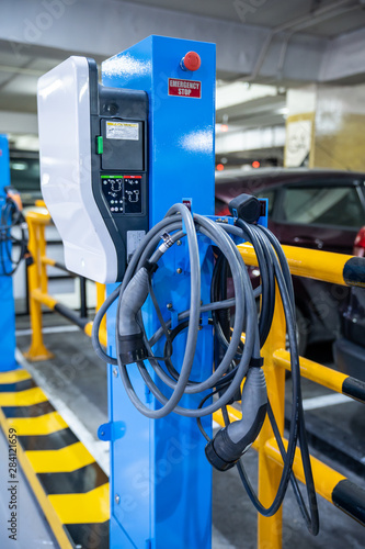 EV Car. Electric car. Charging Station with the power cable plugged in.Technology car. A Future transport. Recharging. High technology . Transportation EV. Transport EV car. Innovation future.