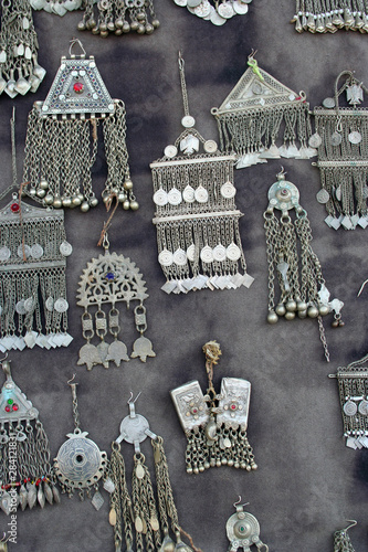 Silver earrings as background