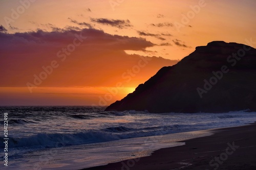Beautiful colorful sunset viewed from the beach - pacific coast near San Francisco, United States of America