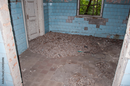 Blue room with the doorway and windows in the abandoned chemical laboratory