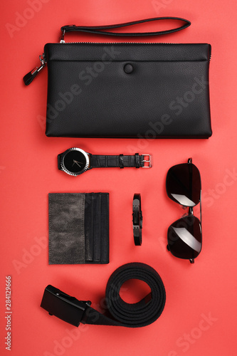 Men's clothing and personal accessories on red background