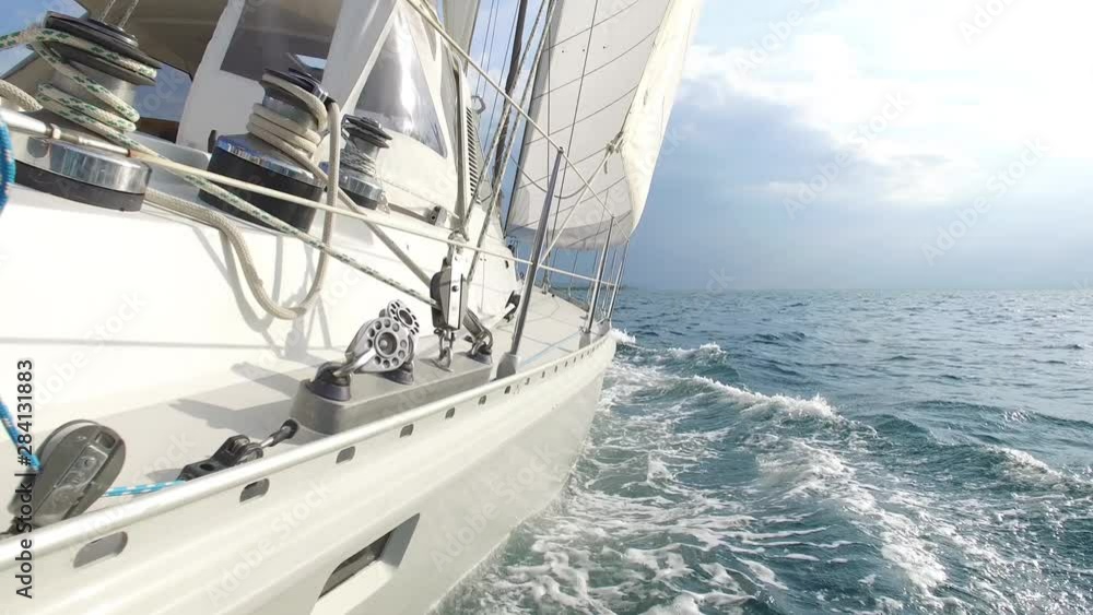 big sailing yacht driving thru the ocean on a sunny day big sailing yacht driving thru the ocean on a sunny day