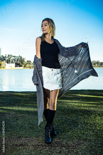 young blonde woman in the park in a sunny day