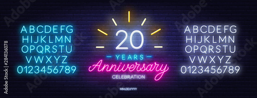20th anniversary celebration neon sign on dark background. Neon alphabet . Template for invitation or greeting card.