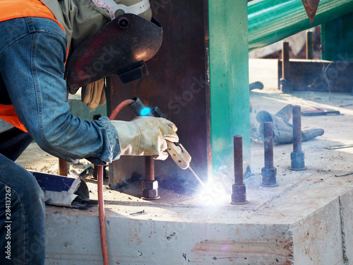 Welding work ,worker with protective welding metal on construction © dear2627