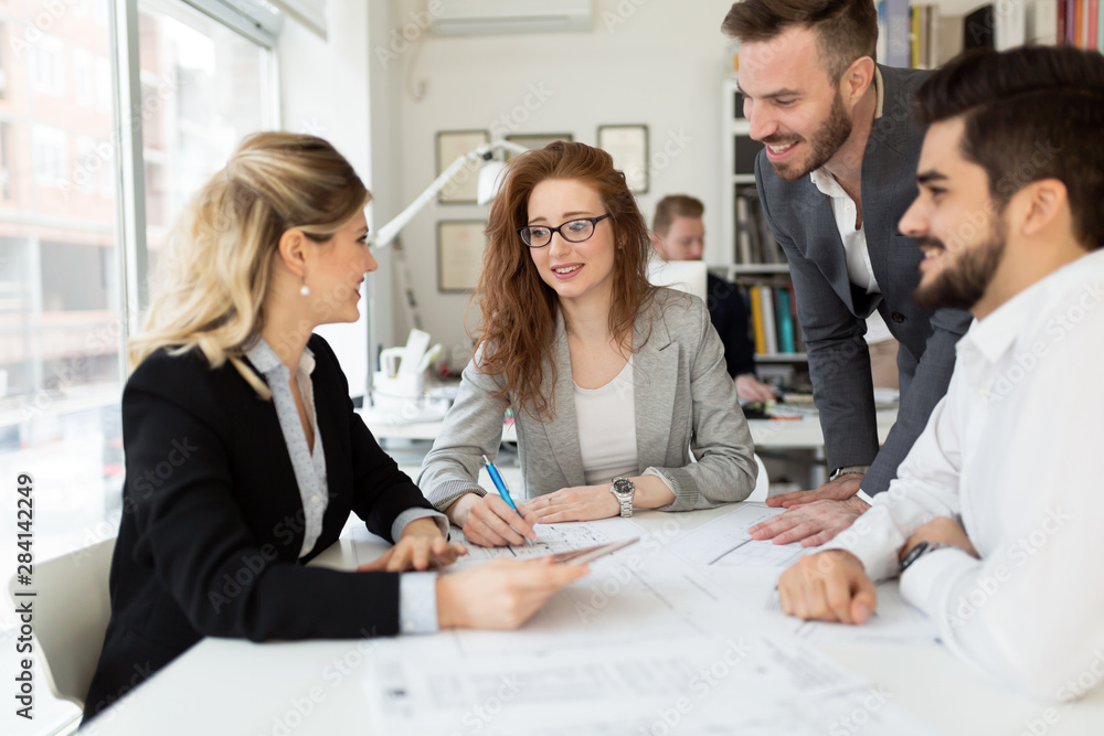 Team of architects working together on project Team of architects working together on project