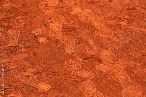 Footprints on a clay tennis court