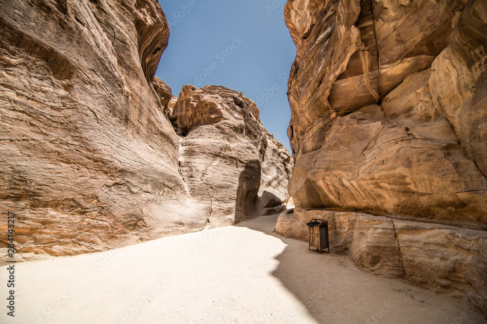 PETRA, JORDAN - May, 2019: Tourists on the way to the city of Petra in Jordan PETRA, JORDAN - May, 2019: Tourists on the way to the city of Petra in Jordan