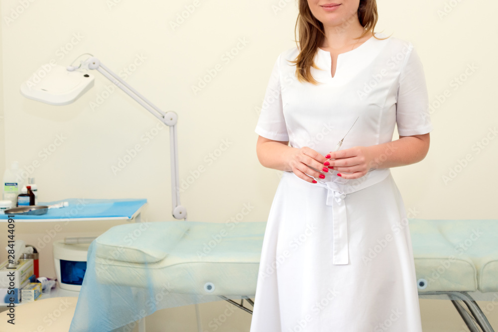 Female doctor with syringe in beauty clinic. Wrinkle treatment. Filler injection for wrinkles smoothing. Plastic aesthetic facial surgery in beauty clinic Female doctor with syringe in beauty clinic. Wrinkle treatment. Filler injection for wrinkles smoothing. Plastic aesthetic facial surgery in beauty clinic