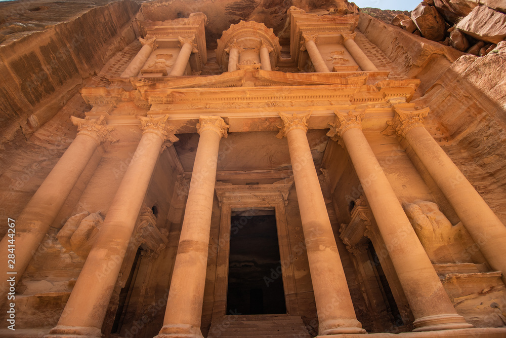 Petra, Jordan - May, 2019: Famous facade of Ad Deir in ancient city Petra, Jordan. Monastery in ancient city of Petra. The temple of Al Khazneh in Petra is one of UNESCO World Heritage