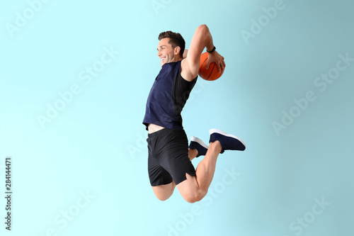 Jumping basketball player o...