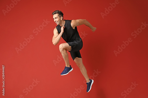 Running sporty man on color...