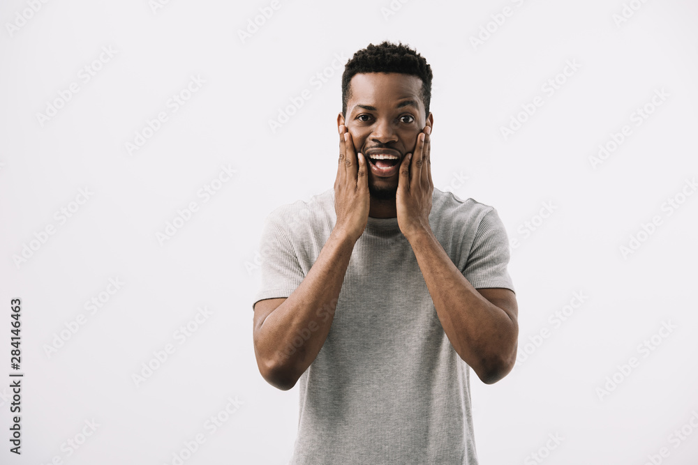 scared african american man touching face isolated on white scared african american man touching face isolated on white