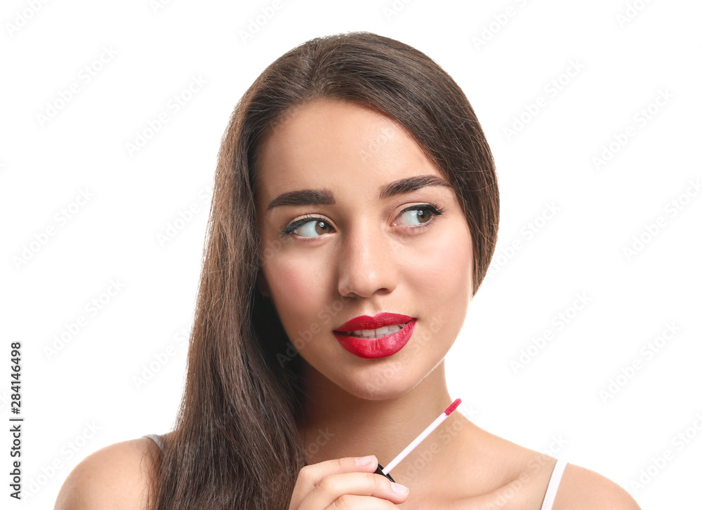Beautiful young woman with lipstick on white background Beautiful young woman with lipstick on white background