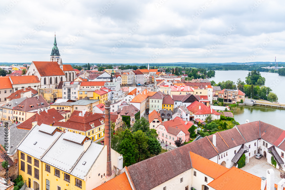Jindrichuv Hradec cityscape with Church of the Assumption of the Virgin Mary, Czech Republic. Aerial view from Black Tower of Jindrichuv Hradec Castle