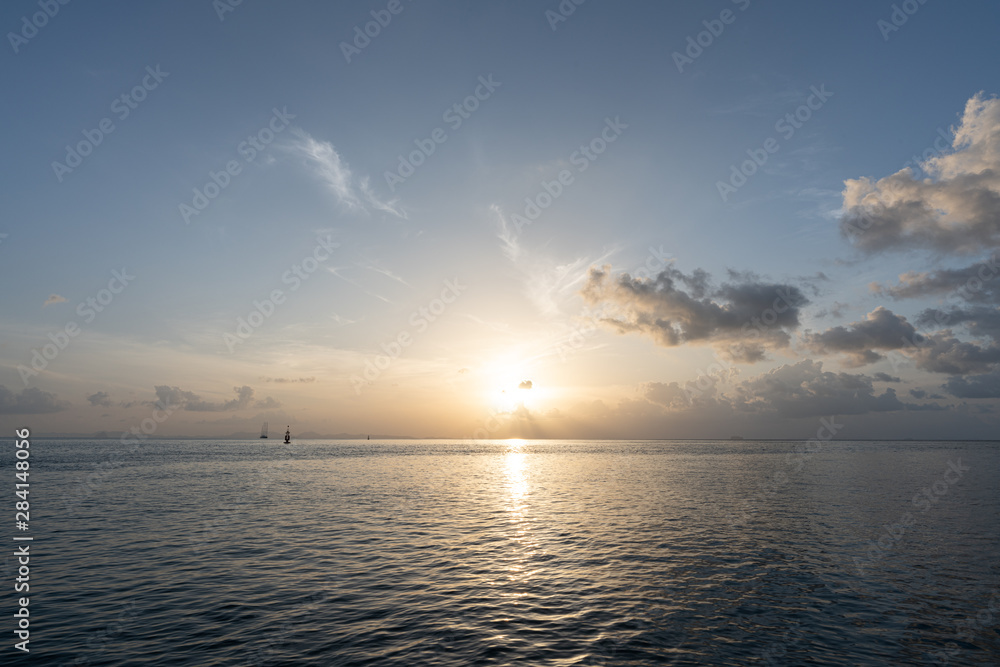 Calm sea with sunrise scene in the background / background texture / sky texture / holiday