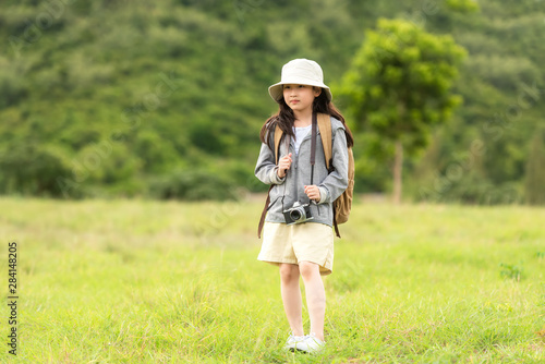 Asian girl take a photo and walking adventure, tourism for destination leisure trips for education and relax in outdoors forest nature.Â  Travel vacations  Concept
