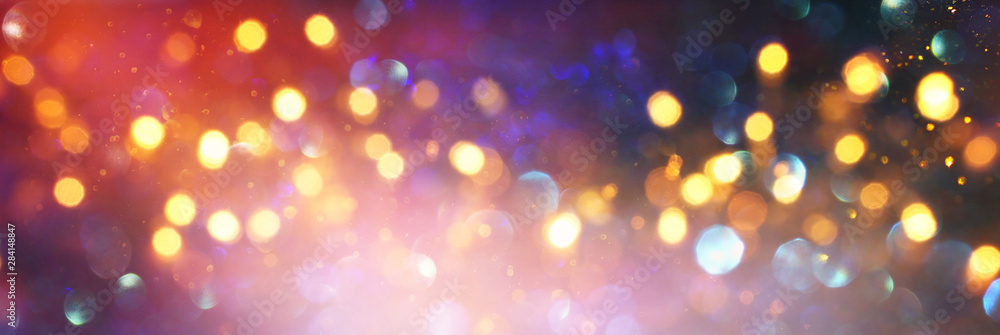 background of abstract red, gold and purple glitter lights. defocused