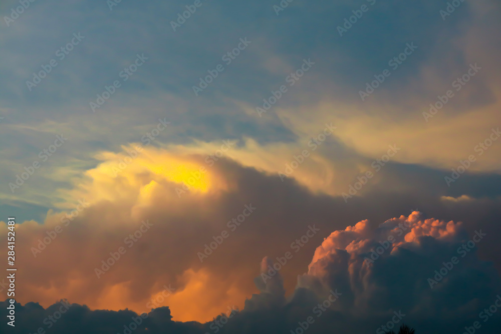 Fototapeta premium sunset orange cloud sunshine in dark sky soft cloud