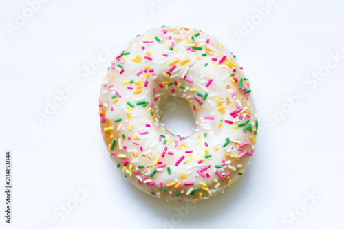 Donut with bright sprinkles on a isolated background, food concept