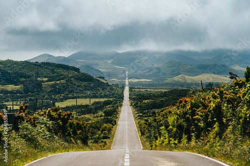 Endless road into the cloudy mountains & hills of Pico Island, Azores, Portugal