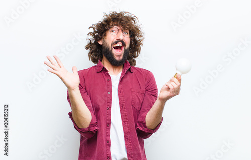 young man with crazy hair in motion shoppimg photo