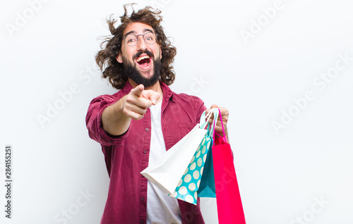 young man with crazy hair in motion shoppimg photo