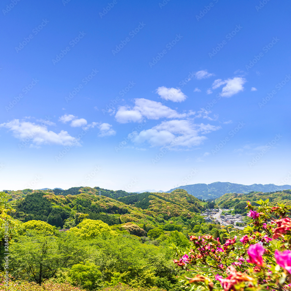 Takeo city with blue sky, skyline top view from Mifuneyama Rakuen in Saga Prefecture, Kashima, Kyushu Japan.
