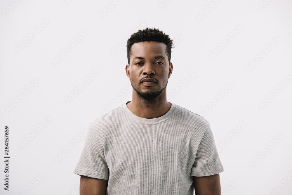 serious and handsome african american man looking at camera isolated on white serious and handsome african american man looking at camera isolated on white