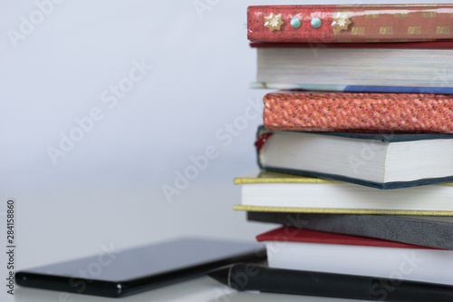 Open book on wood desk in the library room with blurred focus for background, education back to school concept, vintage color tone process