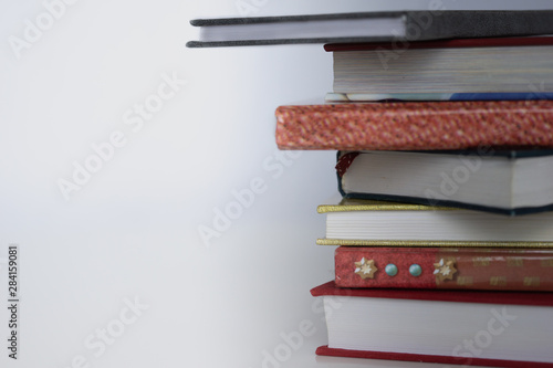 Open book on wood desk in the library room with blurred focus for background, education back to school concept, vintage color tone process