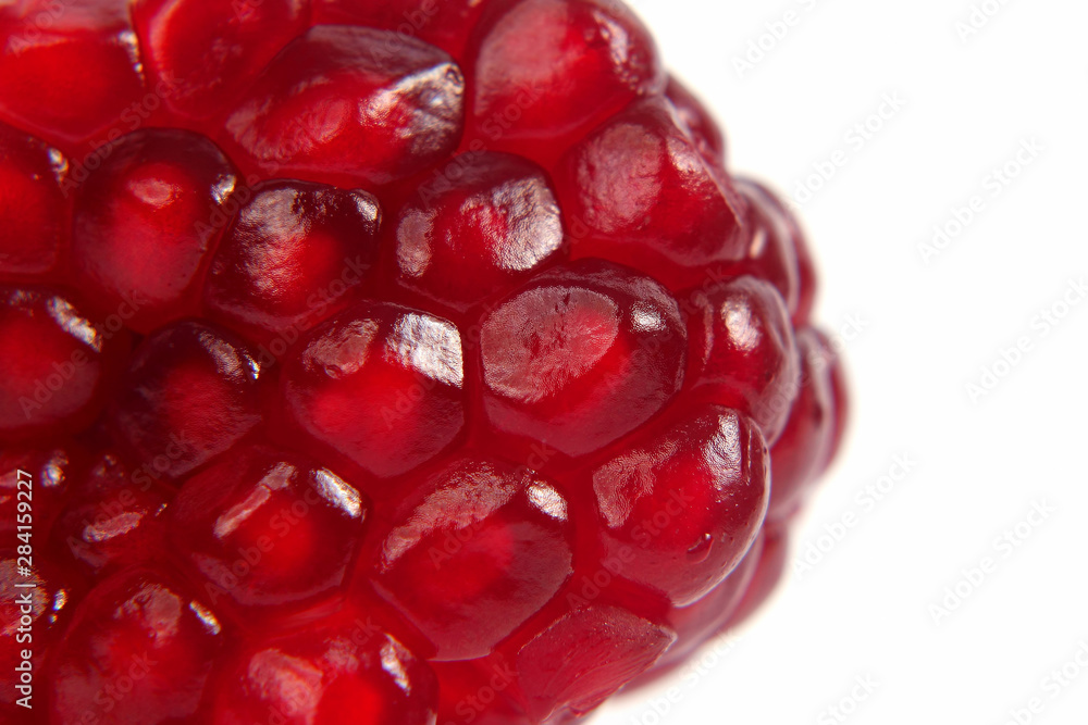 peeled pomegranate fruit closeup on white background peeled pomegranate fruit closeup on white background