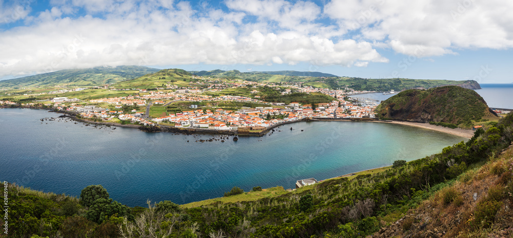 Panorama of the port of Horta and beach of Porto Pim with turquoise water and blue summer sky, Faial Island, Azores Islands, Portugal