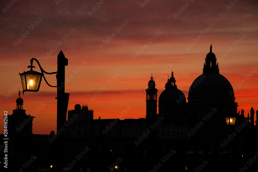 Fototapeta premium Venice winter mysterious romantic: The Basilica of Santa Maria della Salute at sunset