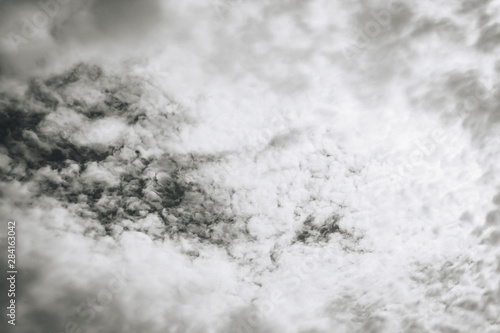White clouds in the dark sky, thunderstorm. monochrome. © Александр Могилевцев