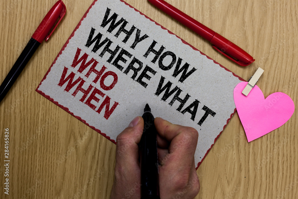 Text sign showing Why How Where What Who When. Conceptual photo Questions to find solutions Query Asking Written sticky note clip pinch heart hand hold marker red pen on wooden desk Text sign showing Why How Where What Who When. Conceptual photo Questions to find solutions Query Asking Written sticky note clip pinch heart hand hold marker red pen on wooden desk