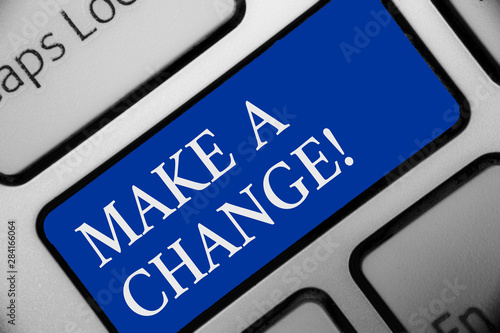 Text sign showing Make A Change. Conceptual photo Try new thing Evolve Evolution Improvement Growth Mature Keyboard blue key Intention create computer computing reflection document