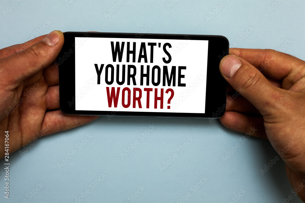 Word writing text What s is Your Home Worth question. Business concept for Value of a house Property Cost Price Rate Human hand hold smartphone with red and black letters on shadow blue floor Word writing text What s is Your Home Worth question. Business concept for Value of a house Property Cost Price Rate Human hand hold smartphone with red and black letters on shadow blue floor