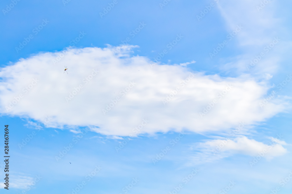White and lush clouds in the blue sky White and lush clouds in the blue sky