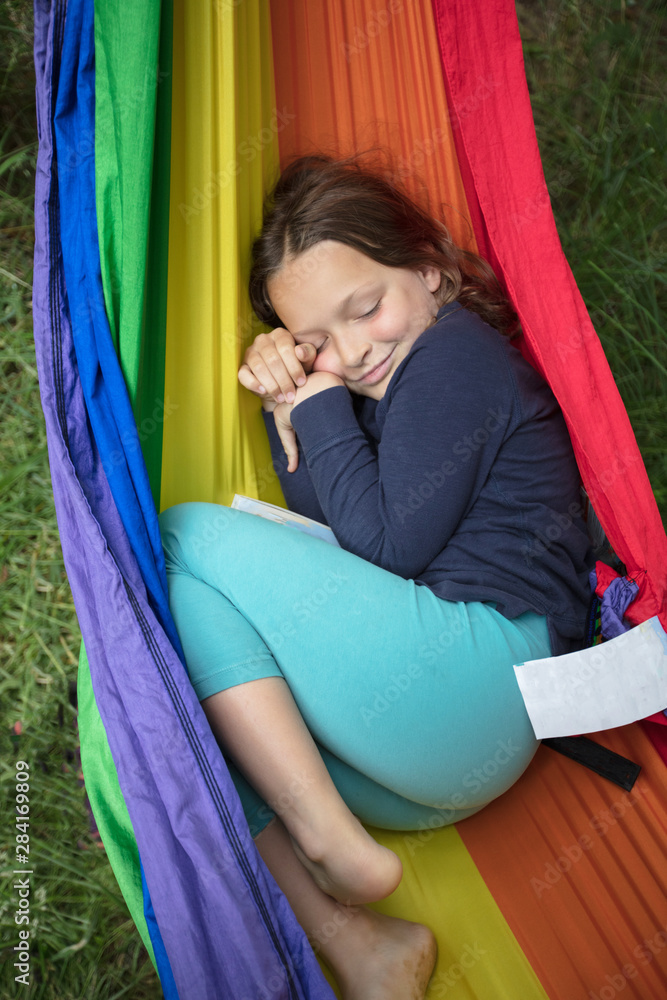 Girl in rainbow hammock