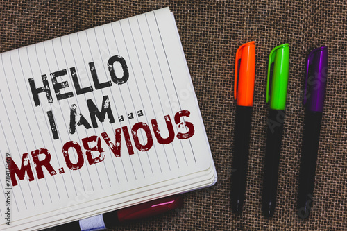 Text sign showing Hello I Am.. Mr.Obvious. Conceptual photo introducing yourself as pouplar or famous person Open notebook page jute background colorful markers Expressing ideas photo