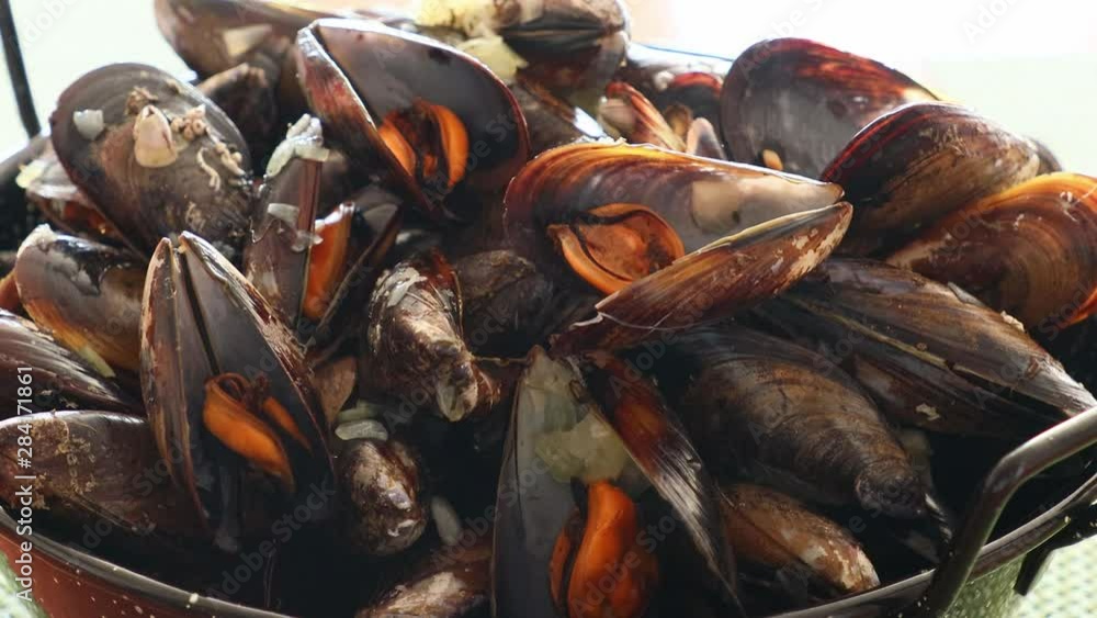 Mussels in copper pot.