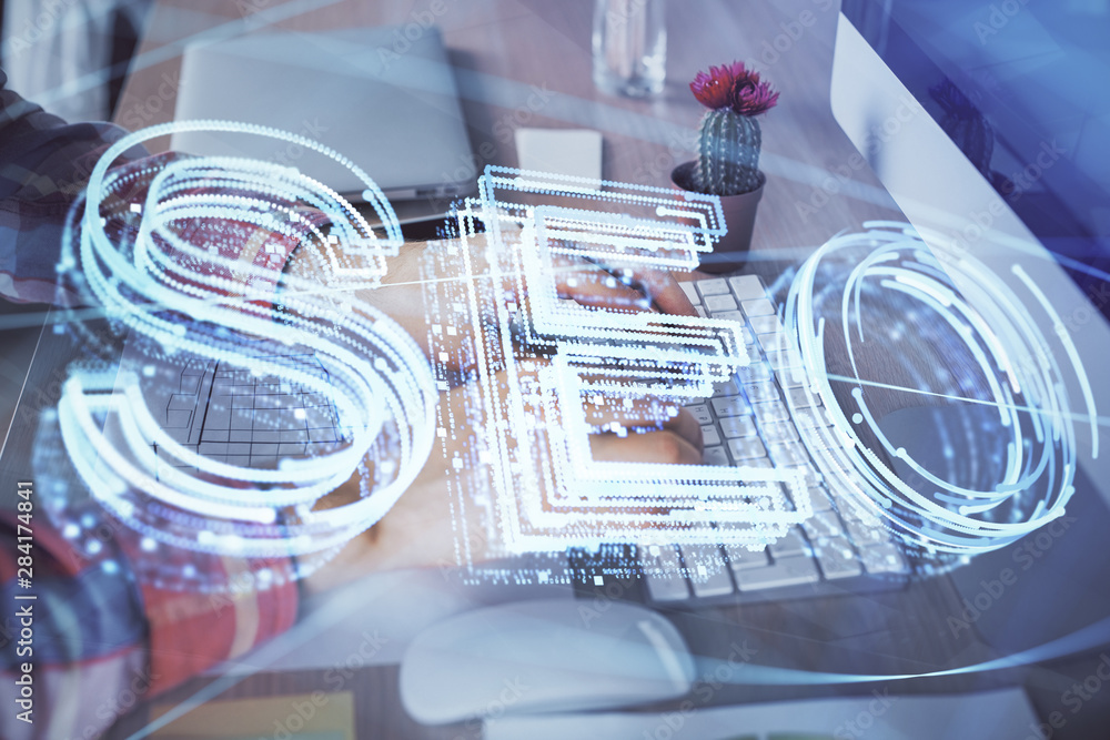 Double exposure of seo icon with man working on computer on background. Concept of search engine optimization. Double exposure of seo icon with man working on computer on background. Concept of search engine optimization.