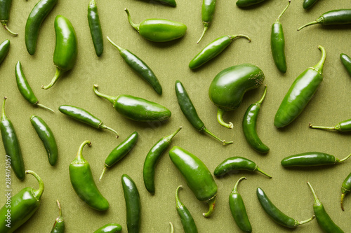 Collection of green shiny chile peppers