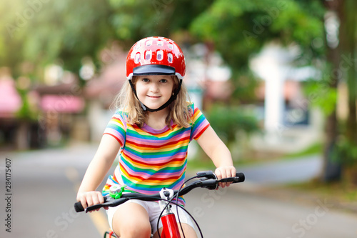 Kids on bike. Child on bicycle. Kid cycling.