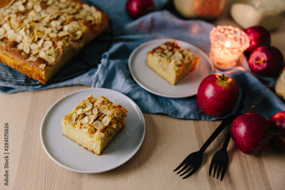 Apple and Almond cake slice on textured plate Apple and Almond cake slice on textured plate