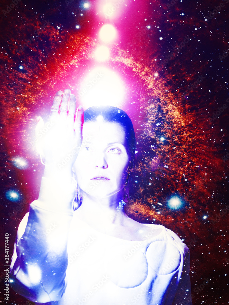 Fantastic portrait of a bright glowing girl among galaxies and stars Fantastic portrait of a bright glowing girl among galaxies and stars