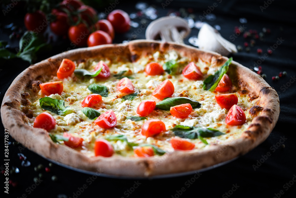 fresh italian pizza with mozzarella, cherry tomatoes & basil fresh italian pizza with mozzarella, cherry tomatoes & basil
