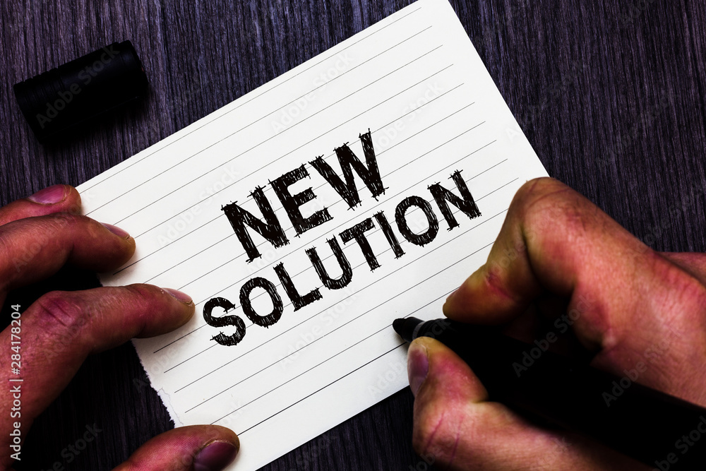 Text sign showing New Solution. Conceptual photo Modern Innovation Latest effective approach to a problem Man holding marker notebook page communicate ideas Wooden background Text sign showing New Solution. Conceptual photo Modern Innovation Latest effective approach to a problem Man holding marker notebook page communicate ideas Wooden background