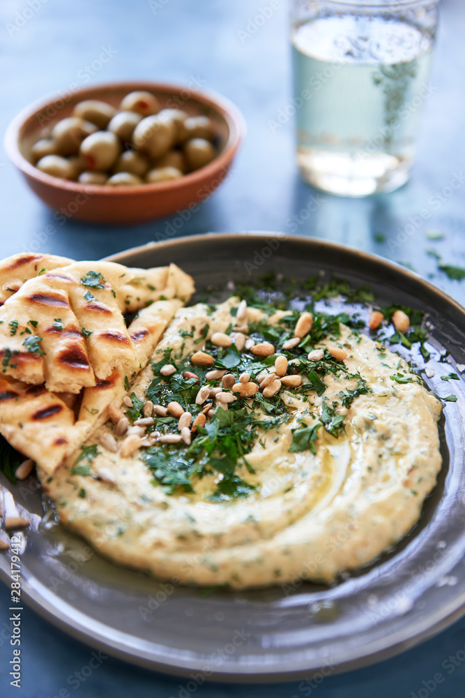 herb hummus starter with pita bread and olives herb hummus starter with pita bread and olives